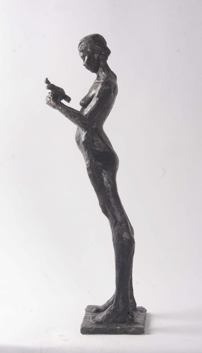 Woman and Dove.   Sculpture by Arabella Brooke. Bronze.