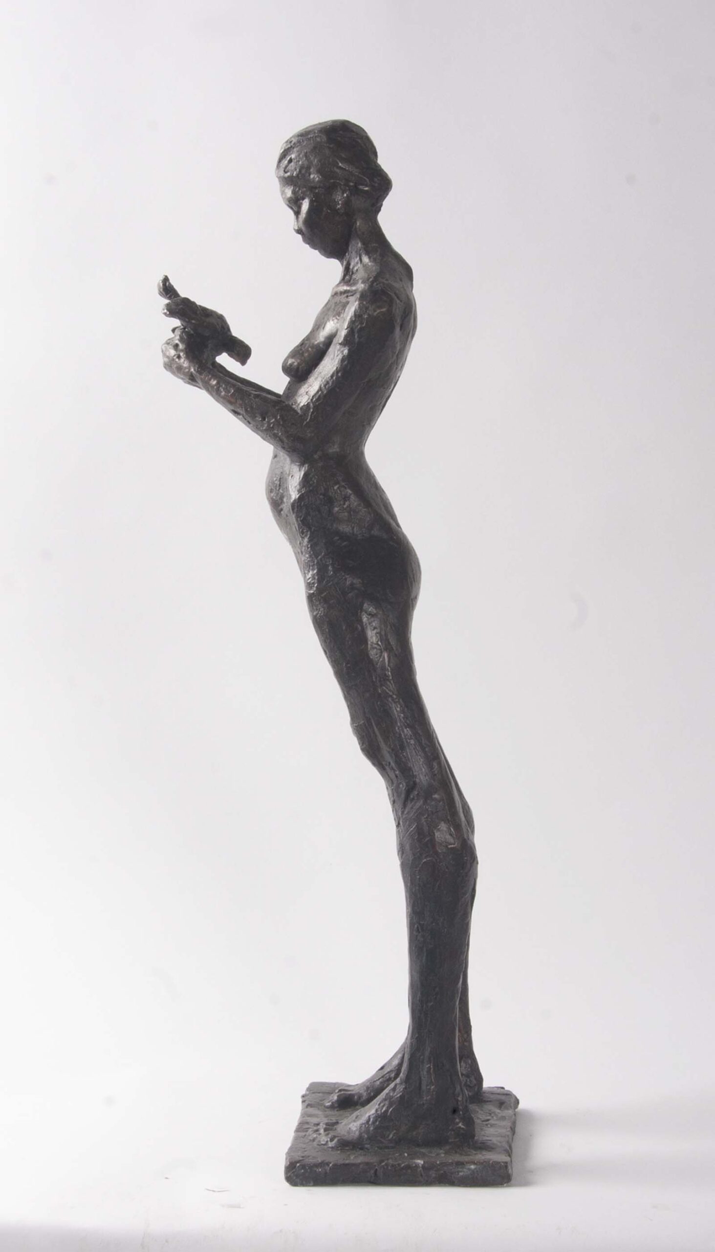 Woman and Dove.   Sculpture by Arabella Brooke. Bronze.