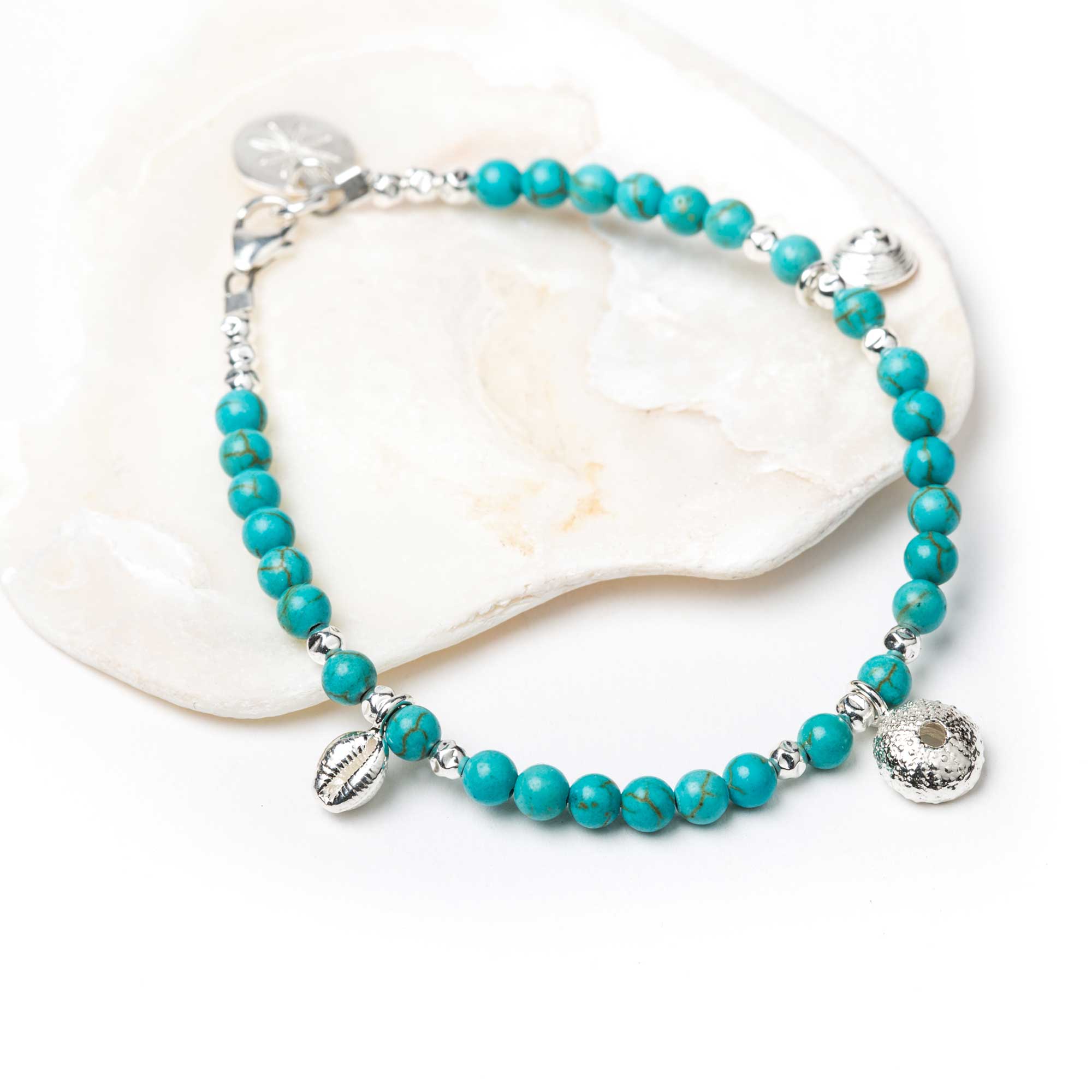 Cowrie on Turquoise bracelet. Jewellery by Helen Butler. . Cowrie on Turquoise bracelet. Jewellery by Helen Butler. .