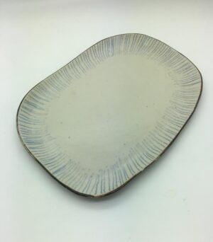 Plate with blue stripes.   Ceramics by Sue Mundy. Stoneware.