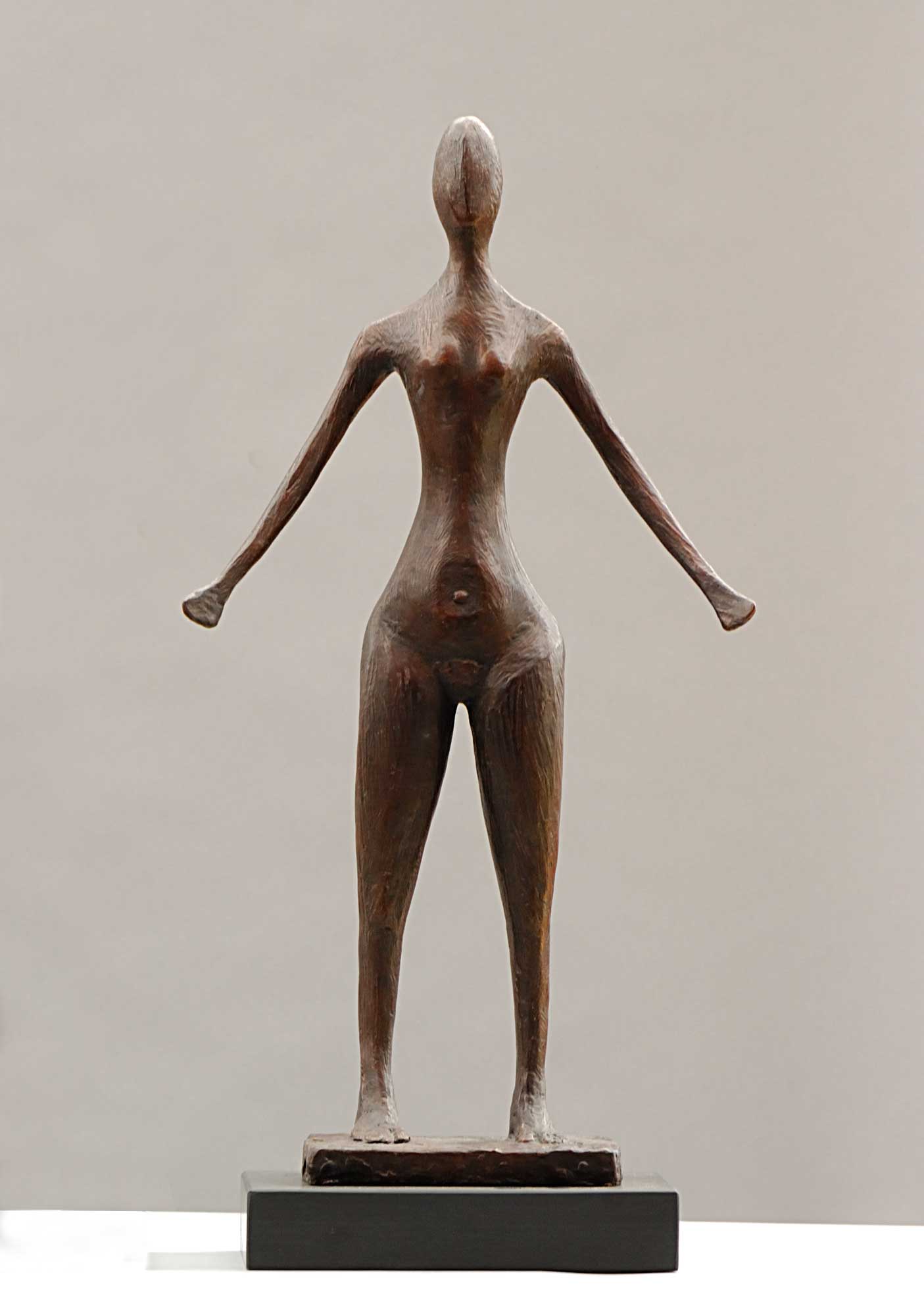 Figure With Arms Down II.   Sculpture by Breon O'Casey. Bronze.