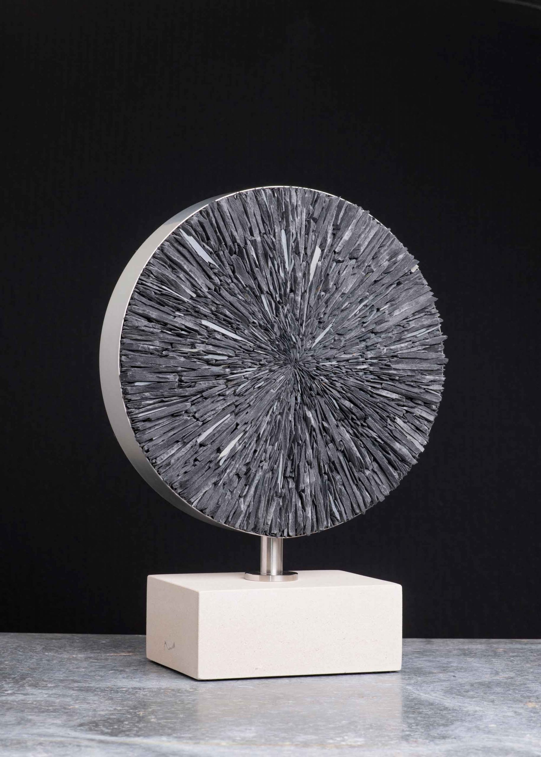 Cirque Blanc. Abstract  Sculpture by Sue Jones. Slate, steel & Portland stone.