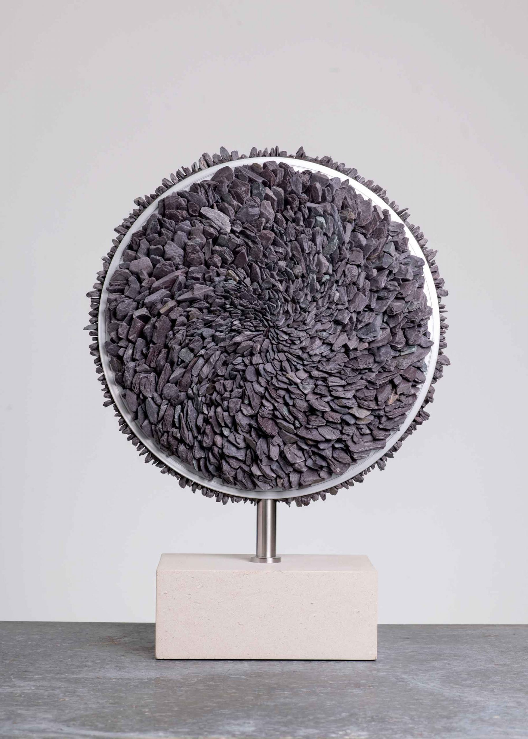 Slate Resonance. Abstract  Sculpture by Sue Jones. Slate, alloy & Portland stone.